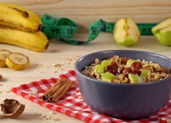 Ayurvedic Diet UK – Balanced plate with fruits, vegetables, spices, nuts, and herbal teas for holistic health in the UK.