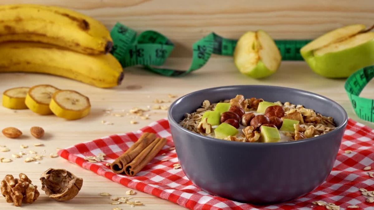 Ayurvedic Diet UK – Balanced plate with fruits, vegetables, spices, nuts, and herbal teas for holistic health in the UK.