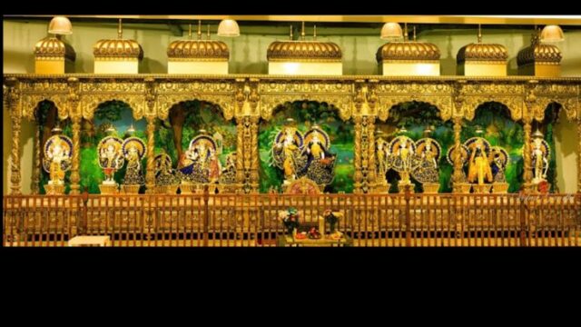 Deity idols displayed inside the sanctum of Leith Hindu Mandir in Edinburgh, adorned with traditional decorations and golden temple architecture.