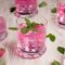 A glass of pink Pathimugam water, Kerala’s traditional Ayurvedic antioxidant drink.