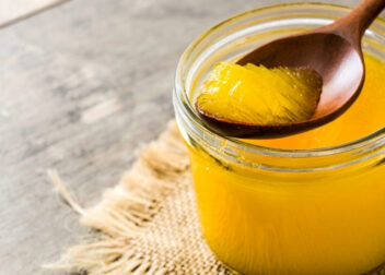 Ayurvedic benefits of drinking ghee in warm water on an empty stomach for digestion and vitality.